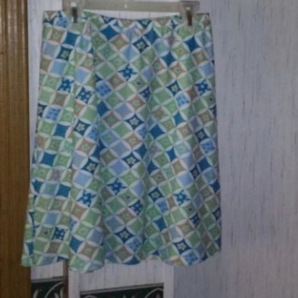 New with tags. Size xsmall. Blue and green swimsuit bottom cover-up